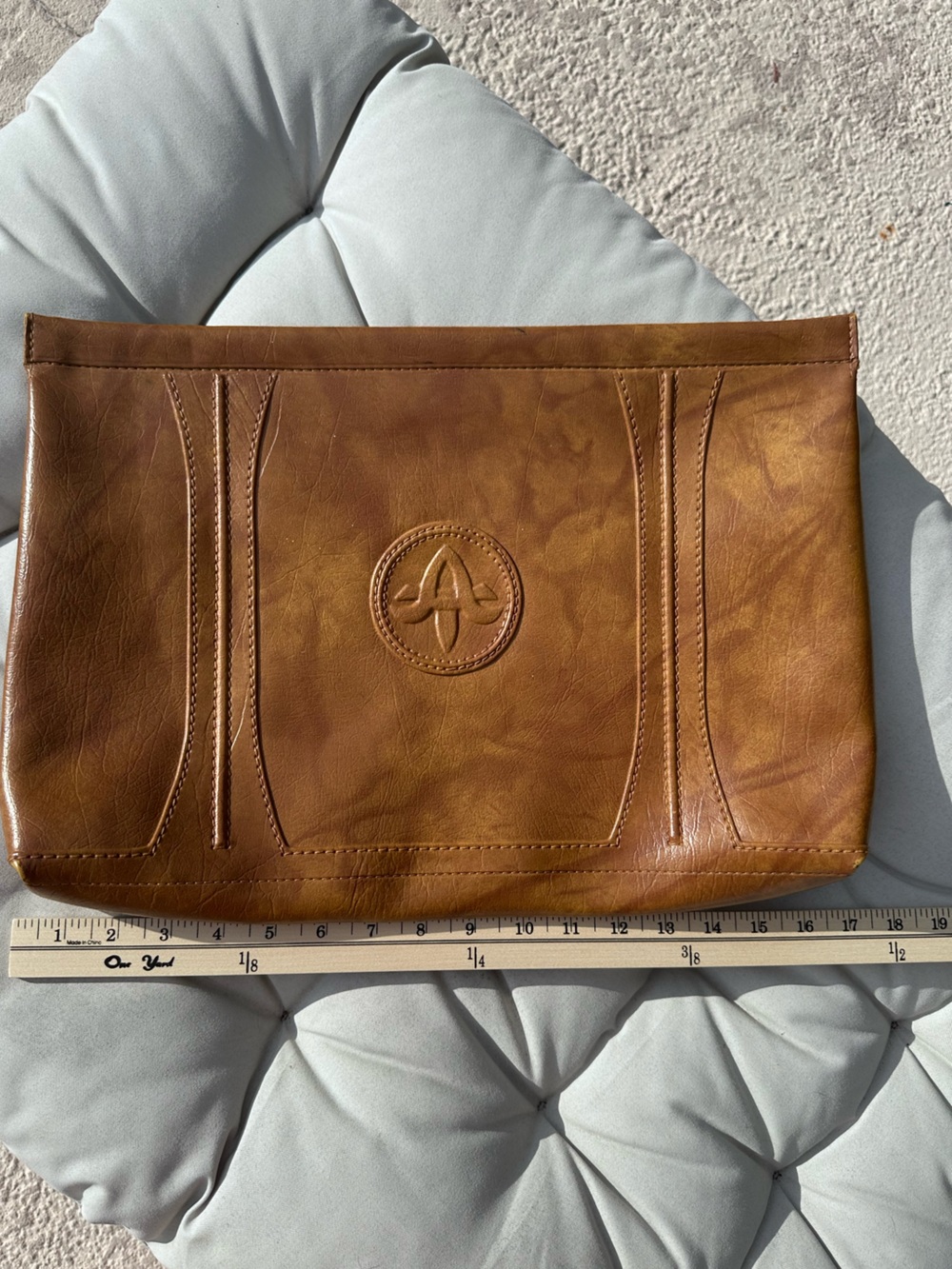 American Tourister 1975Men's Tan Leather Toiletry Pouch with Embossed Round Logo